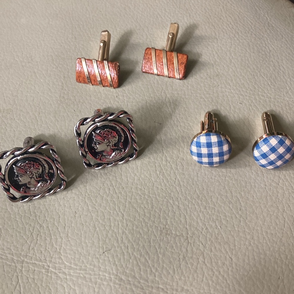 3 pairs of cuff links.  Very unique designs.  Sold as a set.  Vintage.
